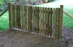 Spring gate in a rabbit fence